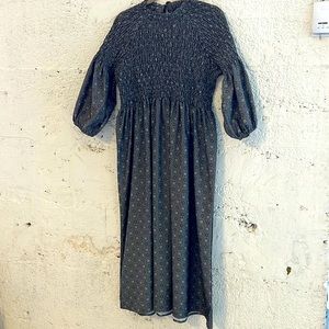 Cutest mock neck smocked midi dress with bow at nape of the neck.